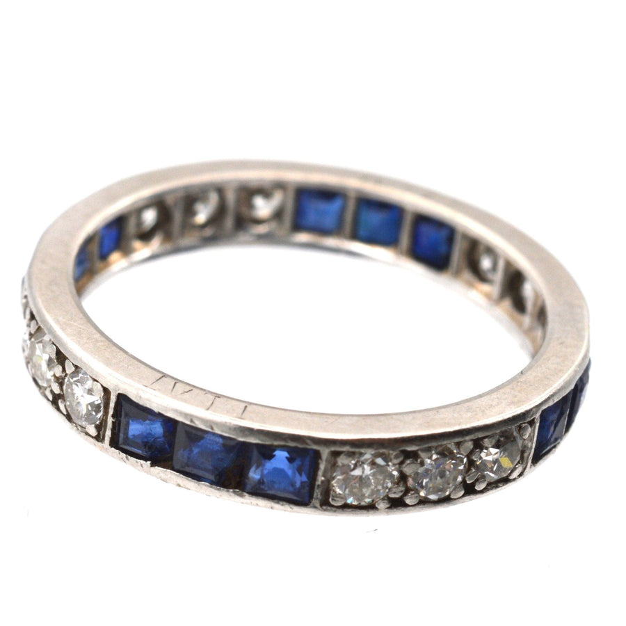 Art Deco 18ct white gold sapphire and diamond eternity ring, featuring blue sapphires and sparkling diamonds.