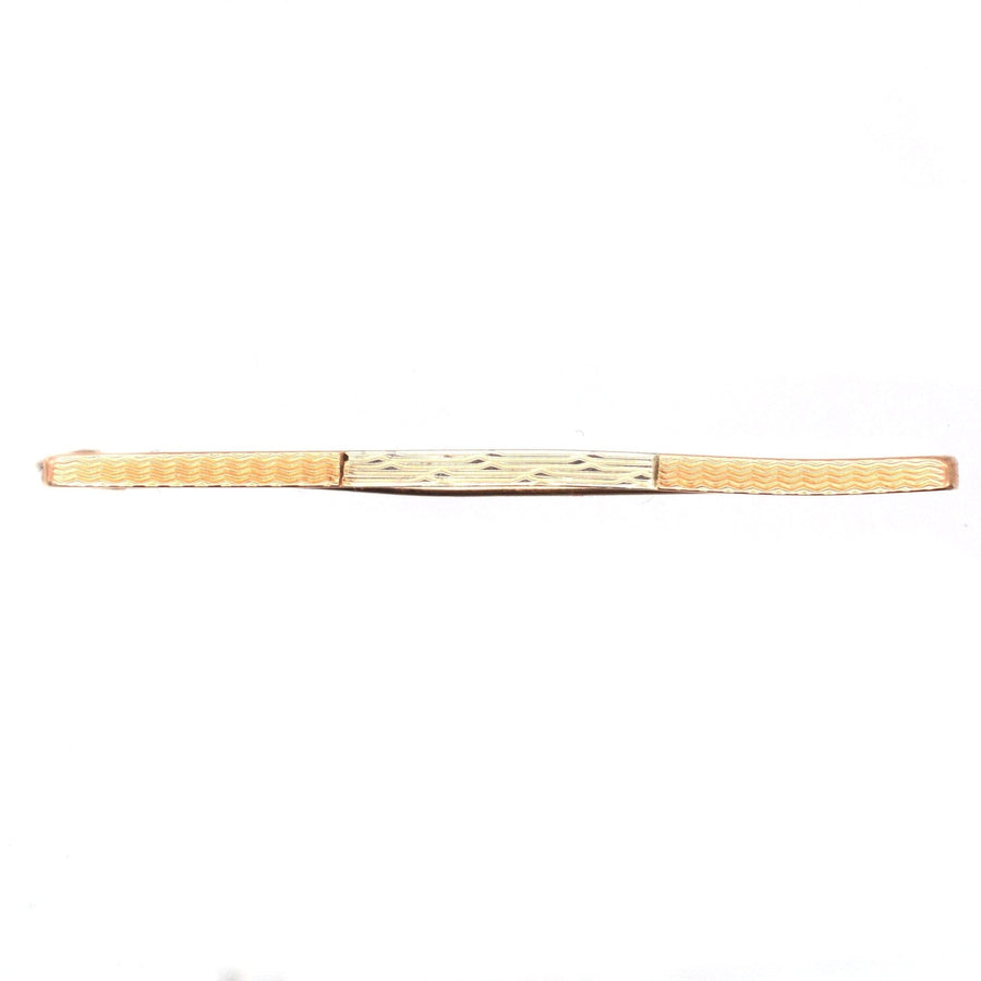 Art Deco 9ct gold and platinum engine turned design bar brooch from 1926, featuring a criss-cross motif.