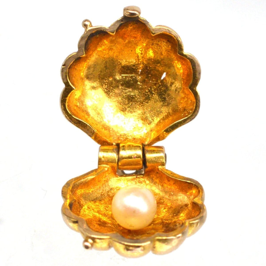 Art Deco 9ct gold scallop shell pendant charm open with pearl inside, showcasing elegance and historical significance.