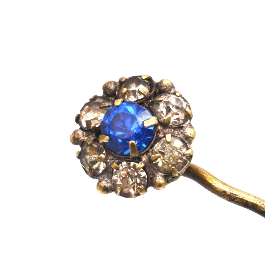 Art Deco blue and white paste cluster tie pin featuring a vibrant blue center stone and sparkling surrounding accents.