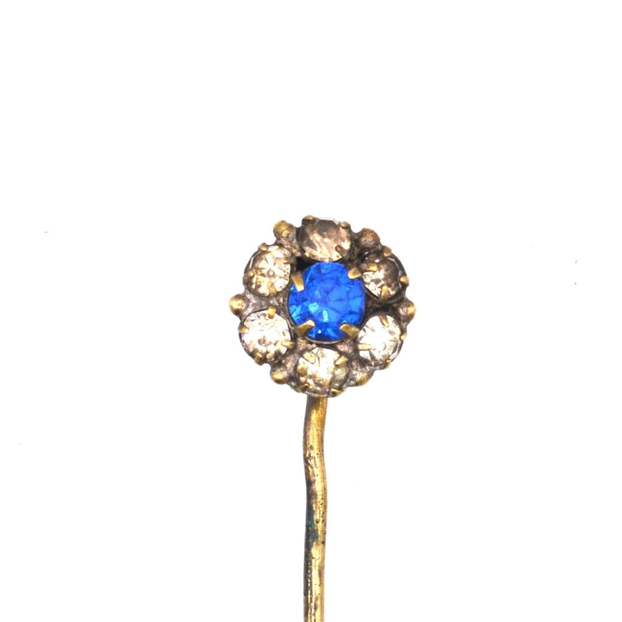 Art Deco blue and white paste cluster tie pin featuring a vibrant blue center, set against sparkling clear stones.