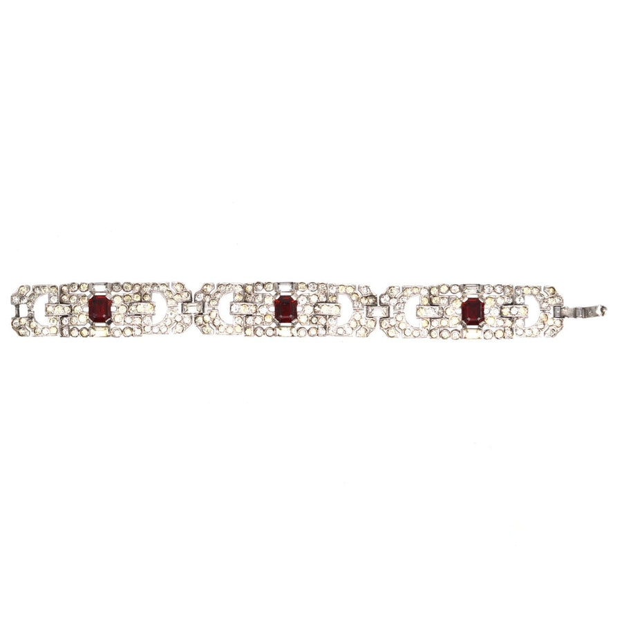 Art Deco chrome bracelet featuring red paste stones and faux diamonds, perfect for adding vintage elegance to any outfit.