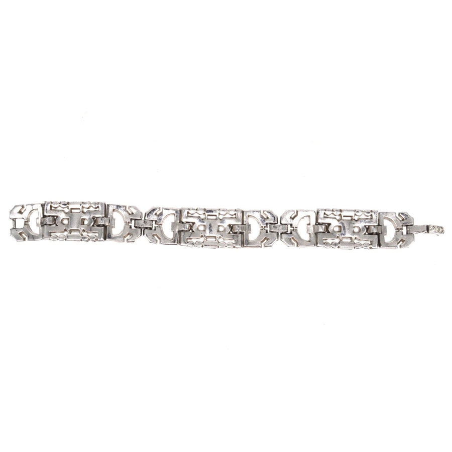 Art Deco chrome bracelet with white and red paste, designed to mimic diamonds and rubies, showcasing exquisite costume jewelry.