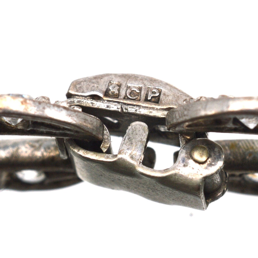 Close-up of Art Deco Ciro silver bracelet clasp showing SCP England hallmark for authenticity.