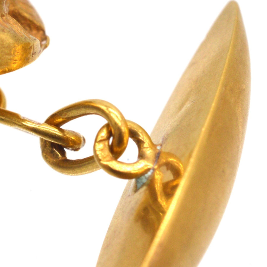 Detail of Art Deco Egyptian Revival 18ct gold scarab cufflinks showcasing gold craftsmanship and design.