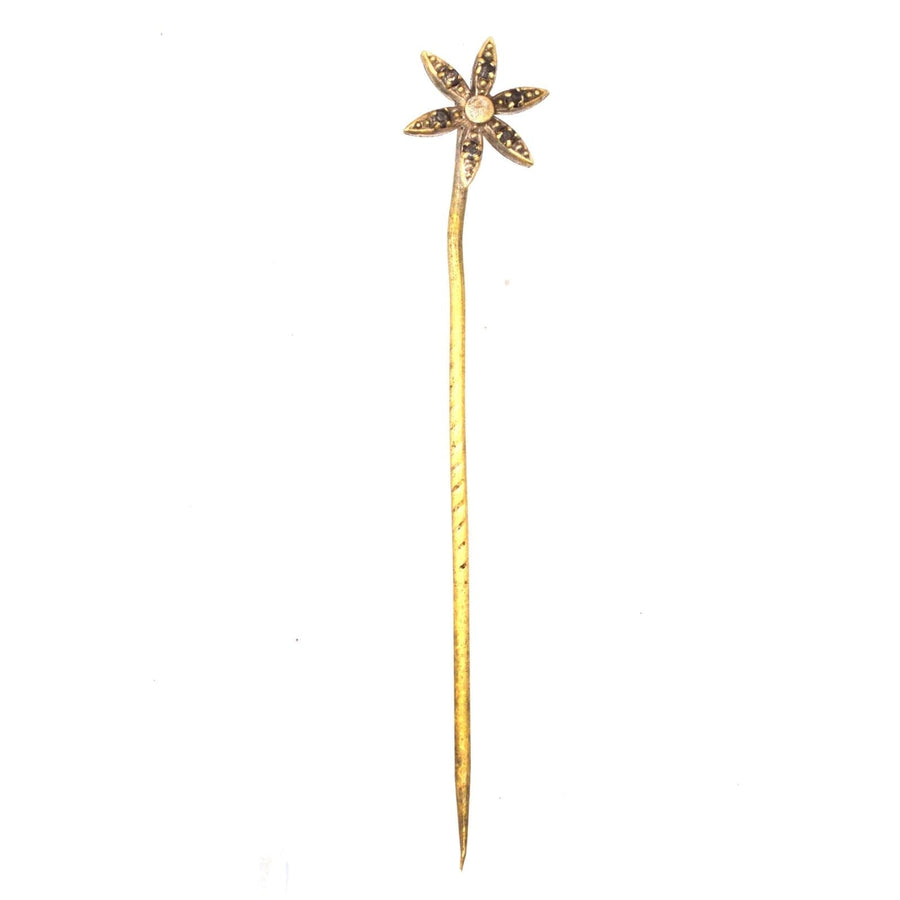 Art Deco flower tie pin with glass paste in each petal, elegant addition to formal attire.