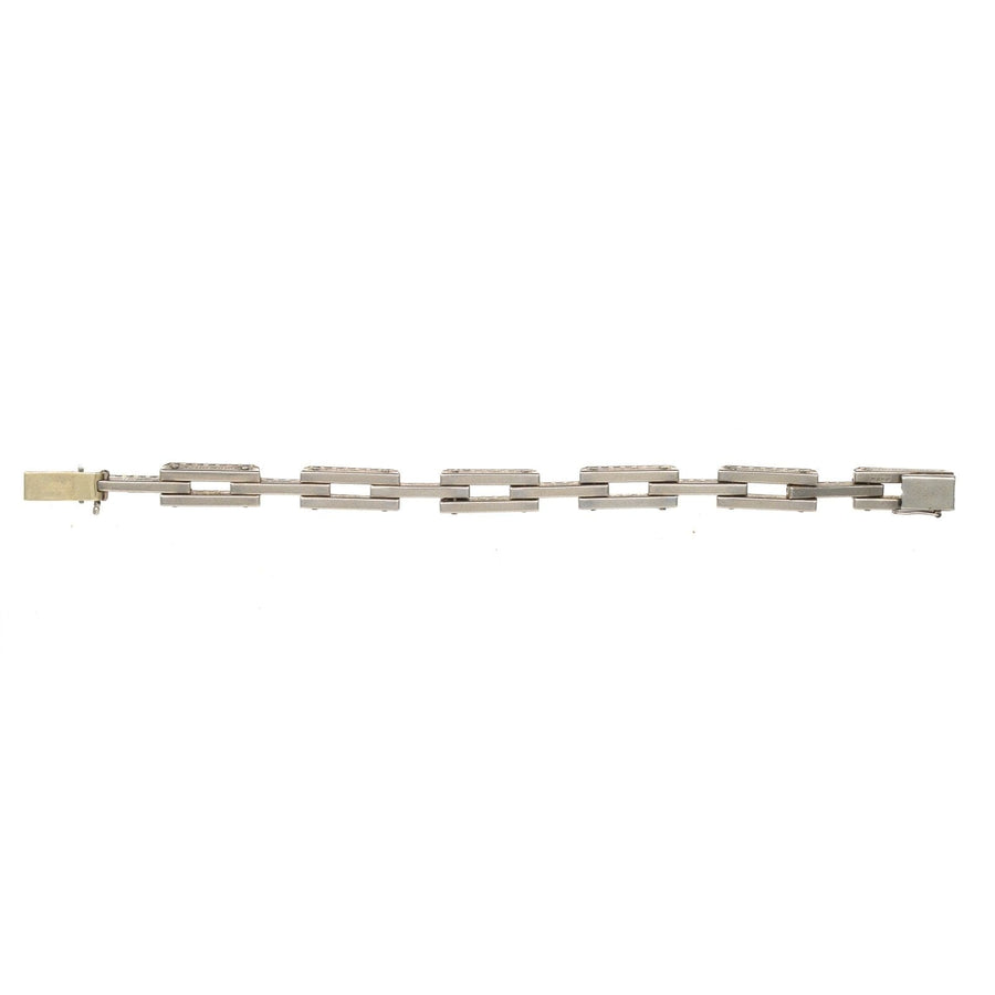 Art Deco German silver and white paste tank bracelet showcasing classic geometric designs and elegant craftsmanship.