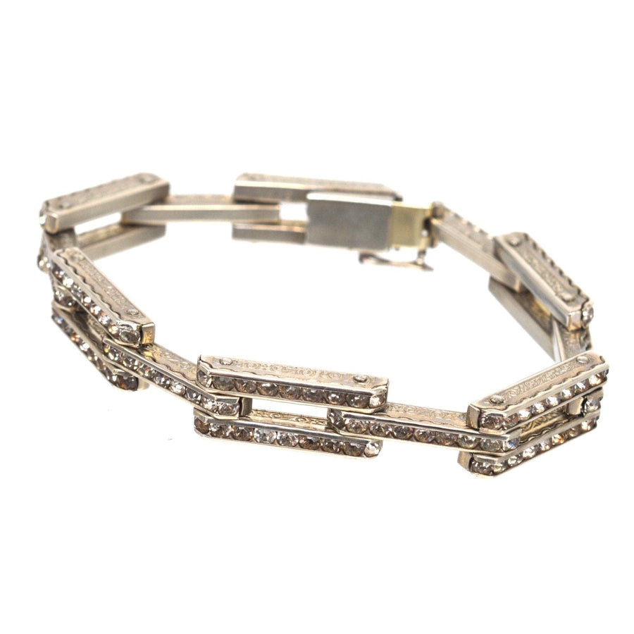 Art Deco German silver bracelet with white paste stones, featuring geometric design and classic style.