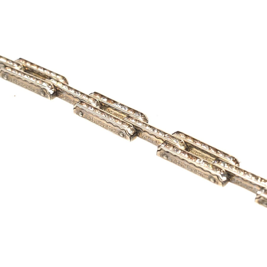 Art Deco German silver tank bracelet featuring white paste stones, showcasing geometric designs and elegant style.