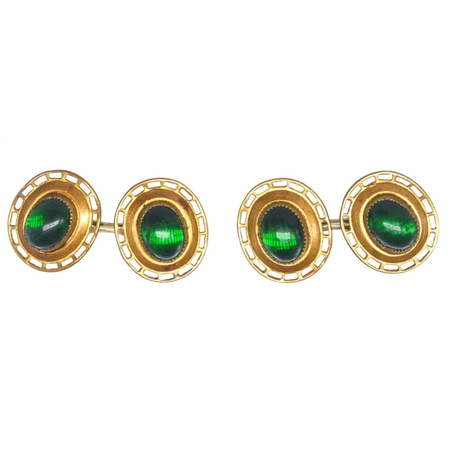 Art Deco gilt metal cufflinks featuring green cabochon paste, resembling emeralds for stylish, cost-friendly jewelry.