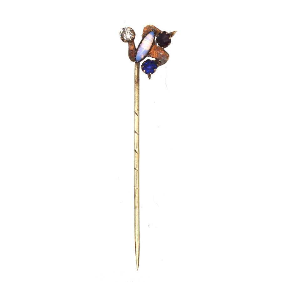 Art Deco Isle of Mann triskelion tie pin featuring blue, red, white and opal paste stones, symbolizing the Three Legs of Mann.