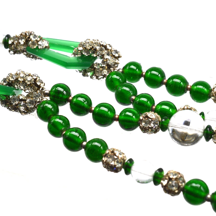 Art Deco long bead green necklace featuring striking green beads and sparkling embellishments, perfect for elegant styling.