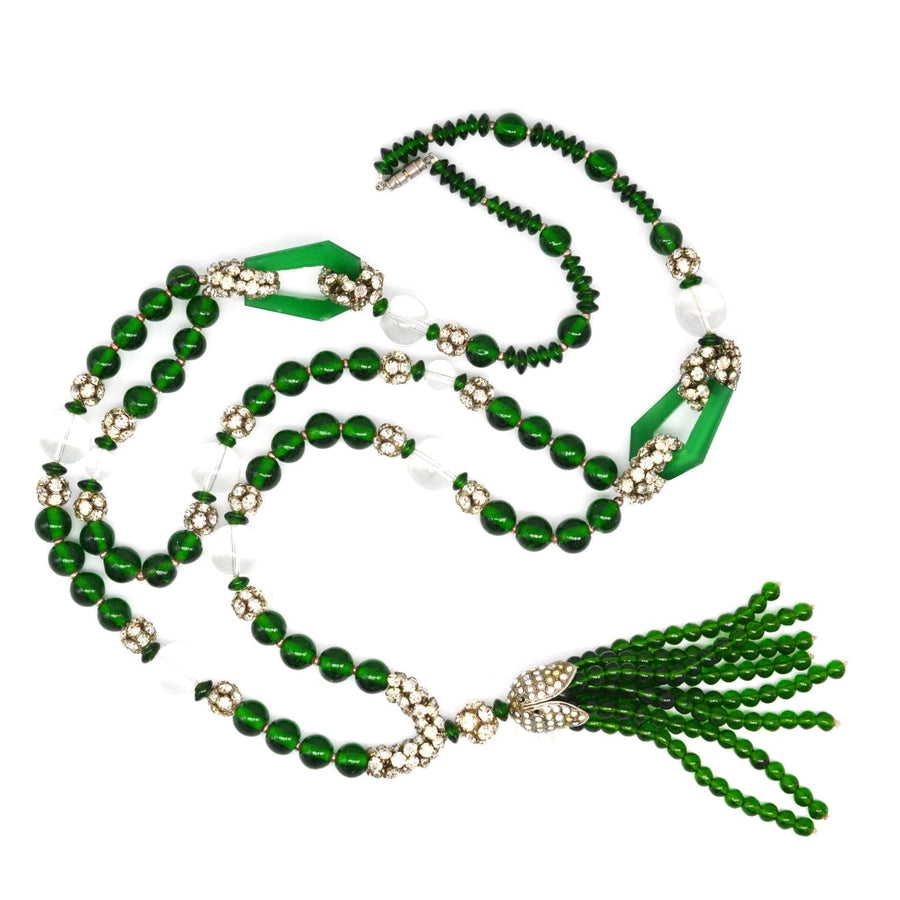 Art Deco long green bead necklace with crystal accents, inspired by royal designs from the 1920s, elegantly styled.
