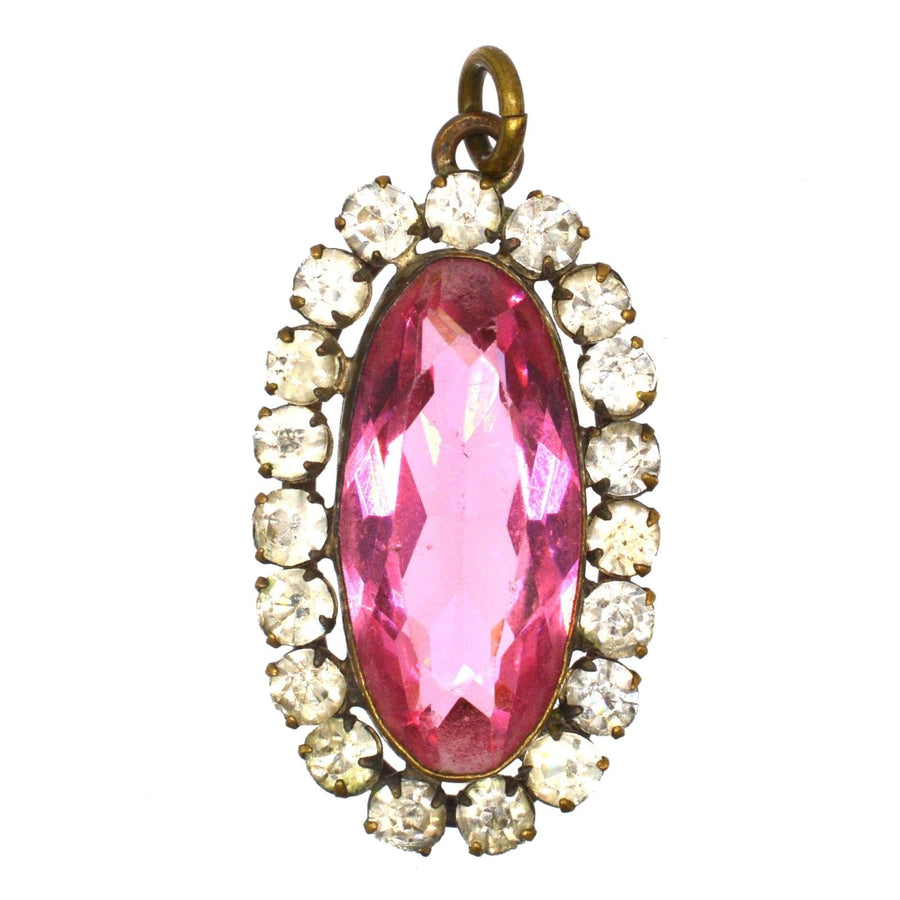 Art Deco pink and white paste cluster oval pendant featuring a large pink topaz surrounded by sparkling clear stones.