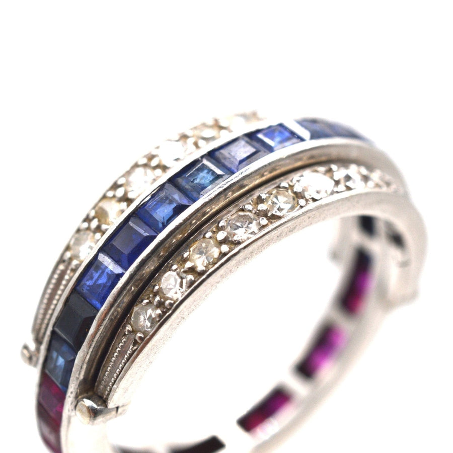 Art Deco platinum diamond flip-over ring featuring sapphire and ruby stones, showcasing exquisite design and craftsmanship.