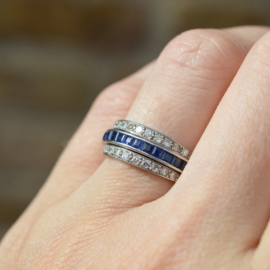 Art Deco platinum diamond ring with sapphire and ruby flip-over design, showcasing a beautiful sparkly setting.
