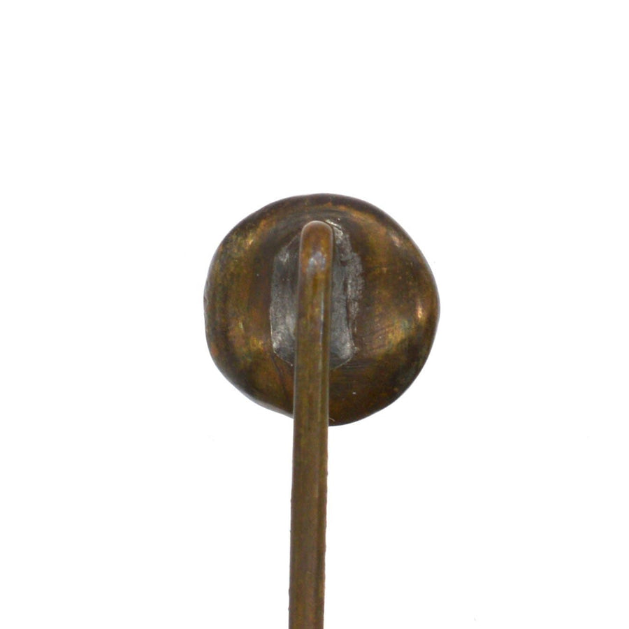 Back view of an Art Deco reverse intaglio tie pin with a polished metal finish and long pin.