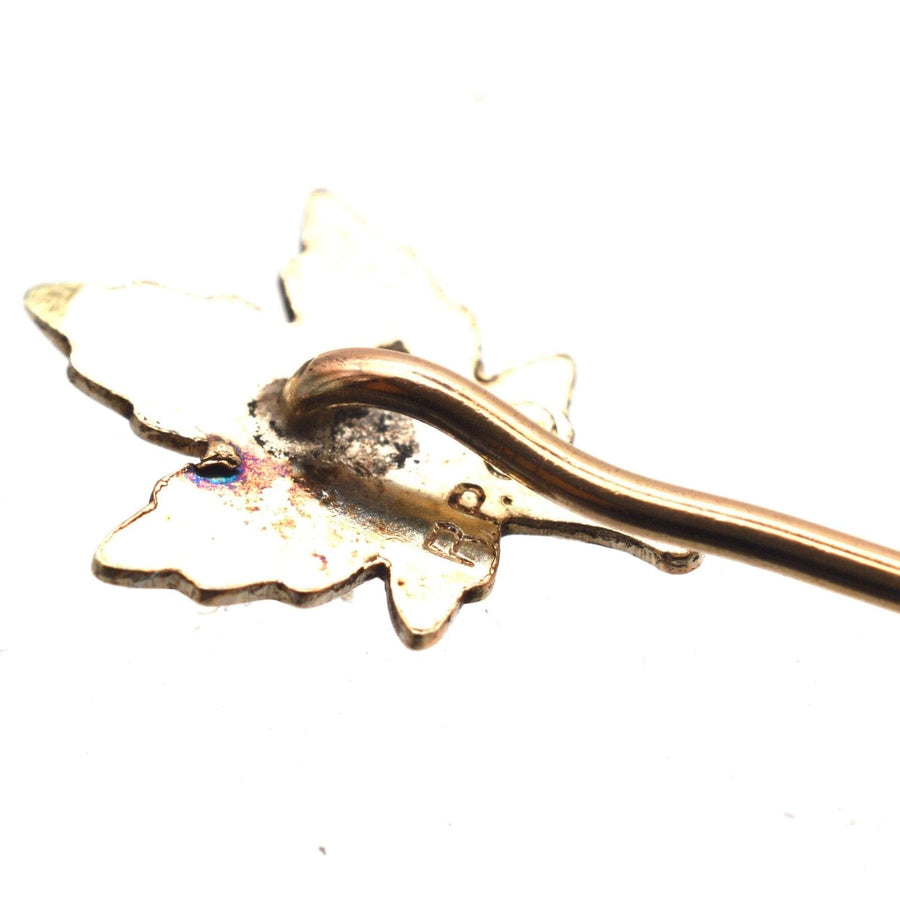 Art Deco rolled gold plate tie pin featuring a detailed maple leaf design, symbolizing Canada and Celtic mythology.