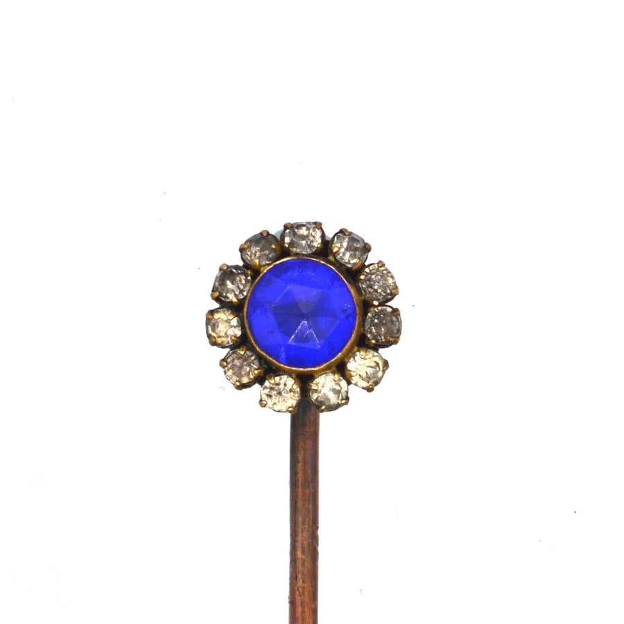 Art Deco tie pin featuring a cobalt blue rose cut glass center surrounded by white paste stones.