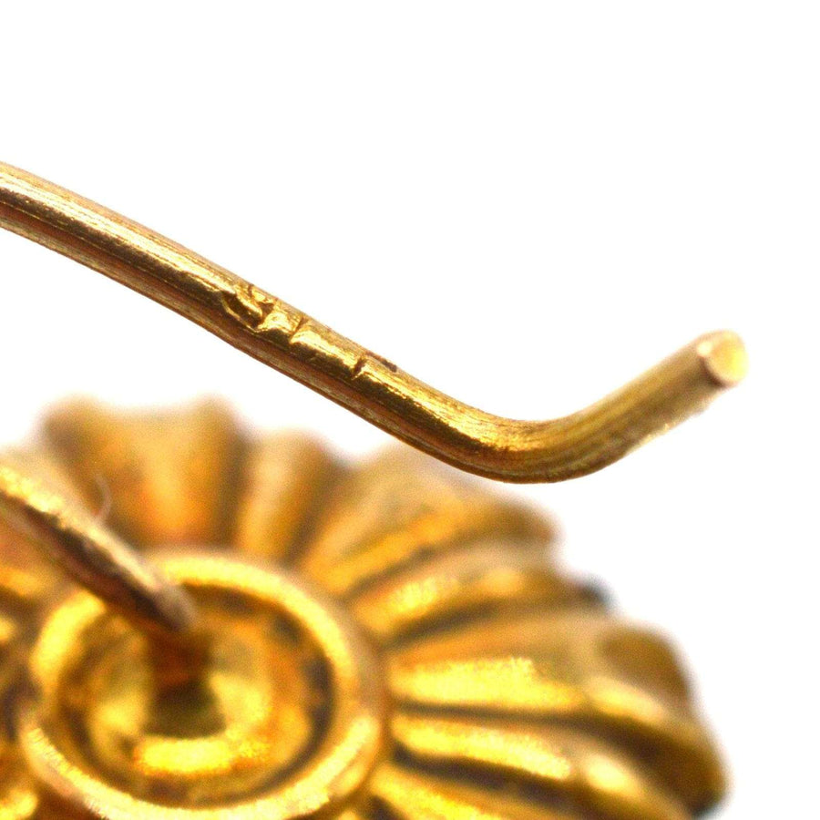 Close-up of the earring hook on Art Deco gold cluster earrings showcasing intricate design details.