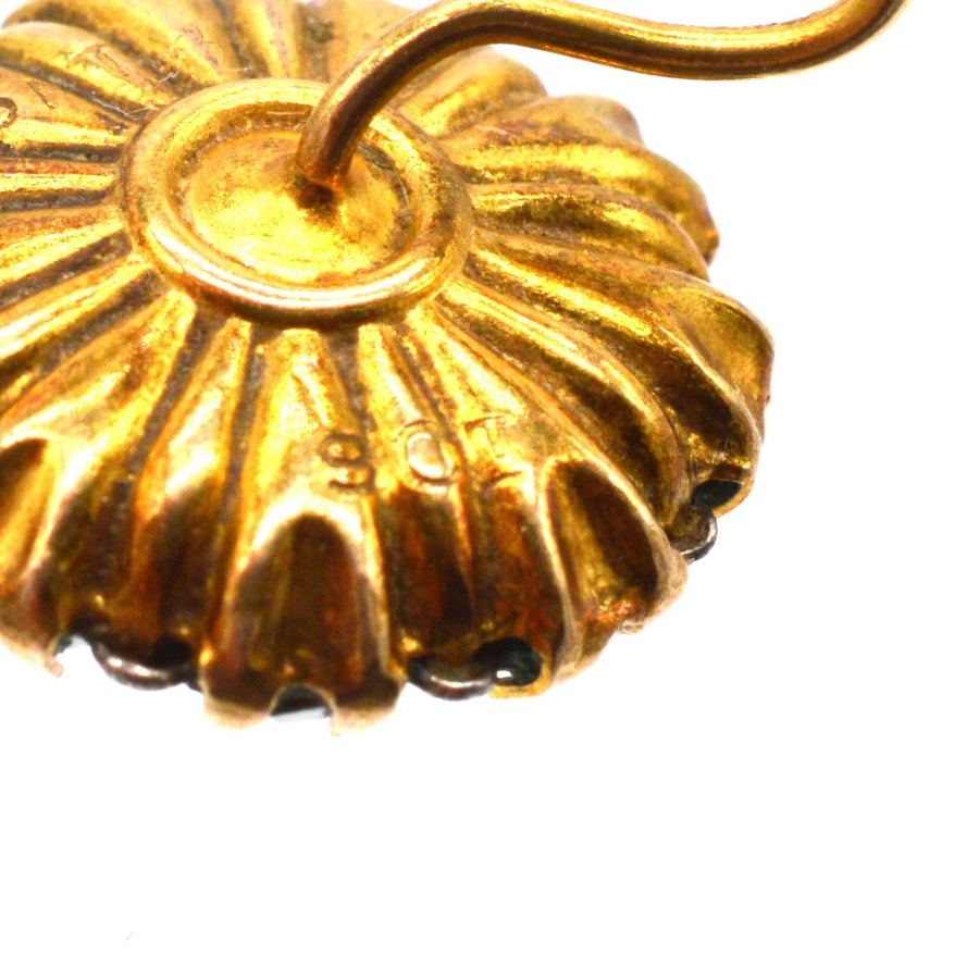 Close-up of Art Deco gold cluster earring, showcasing detailed design and 9ct gold hallmark.