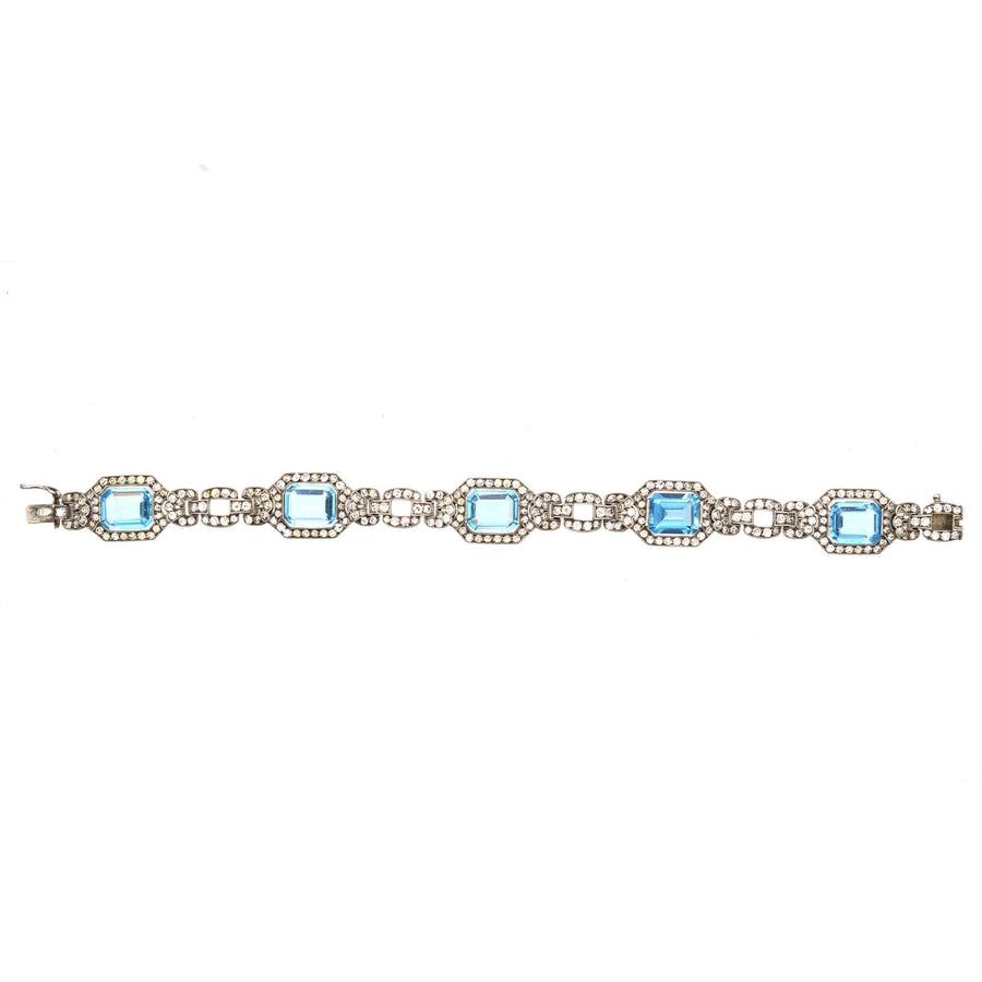 Art Deco silver bracelet featuring blue and white paste stones, reminiscent of aquamarine and diamond designs.