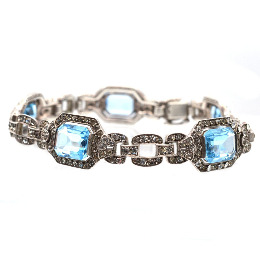 Art Deco silver bracelet featuring blue paste stones and sparkling details, reminiscent of aquamarine and diamonds.