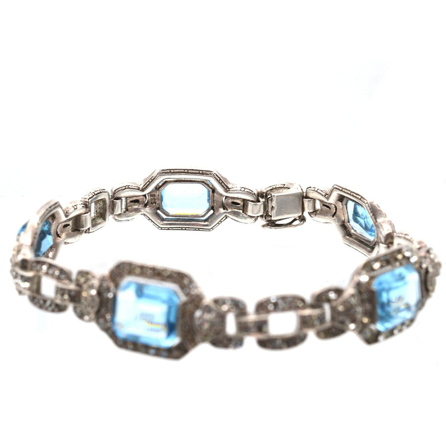 Art Deco silver bracelet with blue and white paste stones, reminiscent of aquamarine and diamond elegance from the early 20th century.