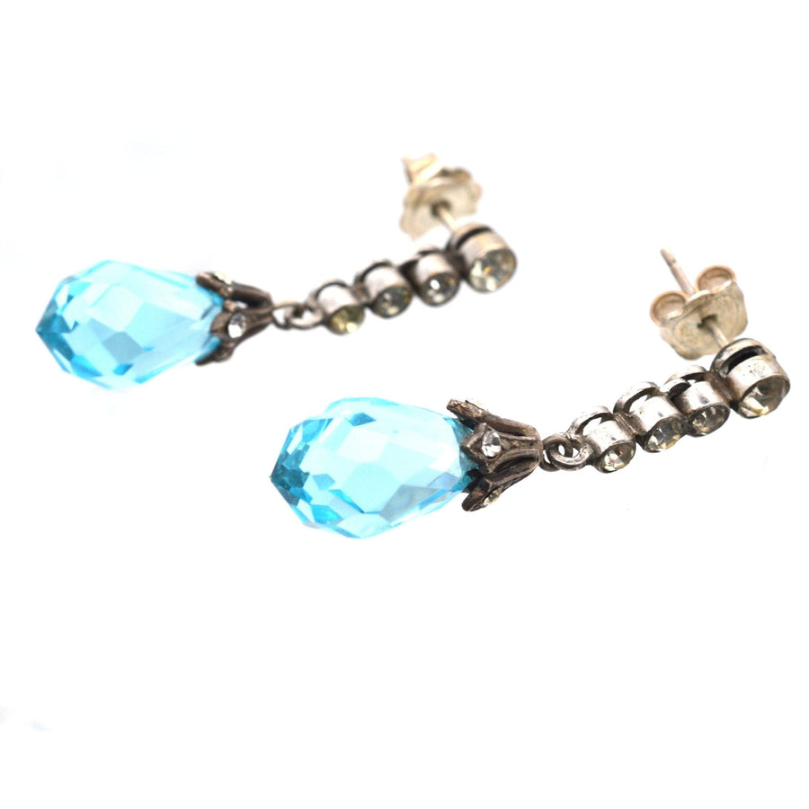 Art Deco silver earrings featuring blue faceted paste and white imitation diamonds, perfect for an elegant look.