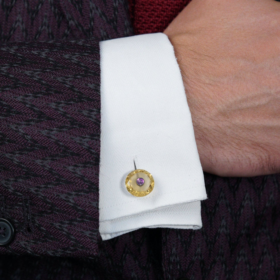 Art Deco cufflink stud featuring citrine and amethyst, styled on a formal shirt with a textured jacket.