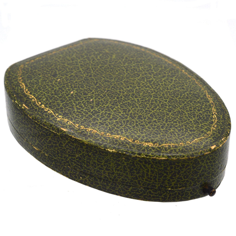 Vintage green leather box for Art Deco dress set featuring intricate detailing.