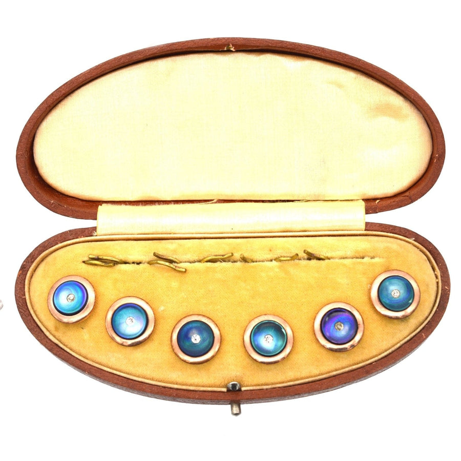 Art Deco dress set in original case with black mother-of-pearl and blue-purple iridescence.