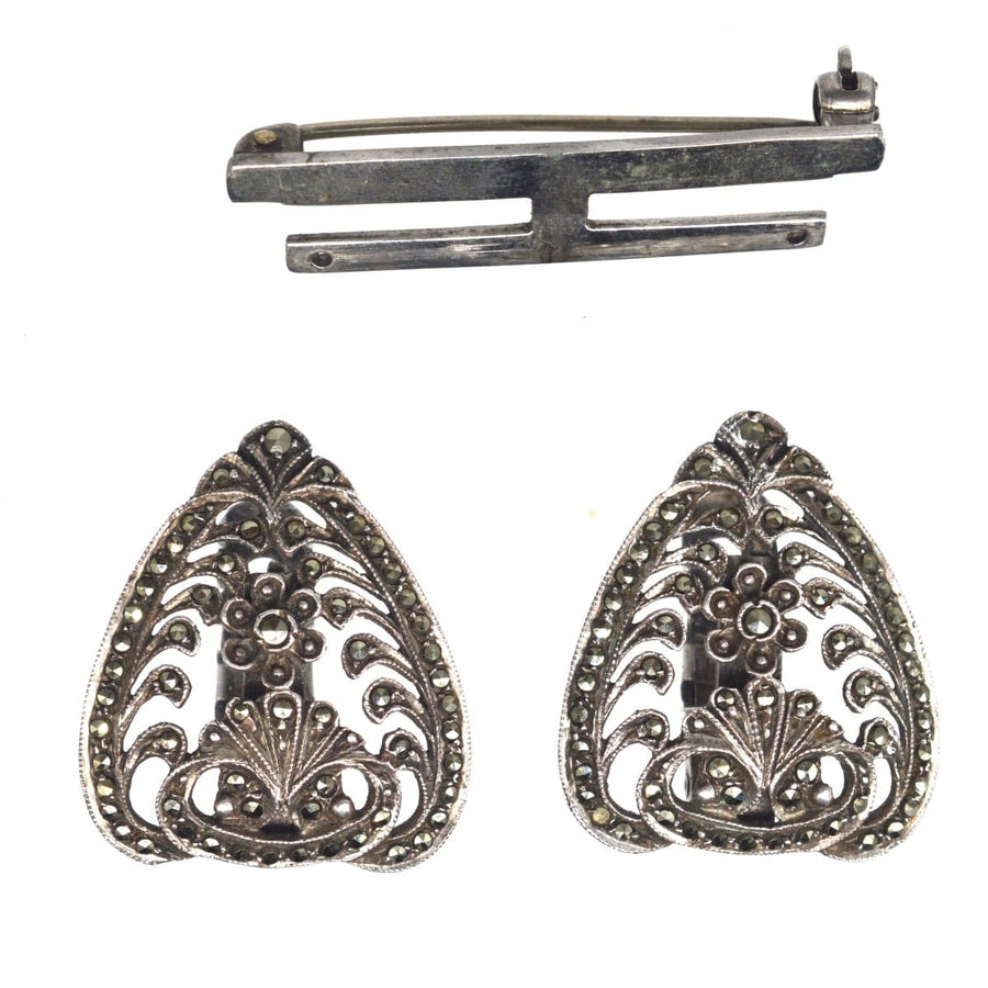 Art Deco silver and marcasite double clip brooch from 1927, featuring intricate floral design and rose cut style.