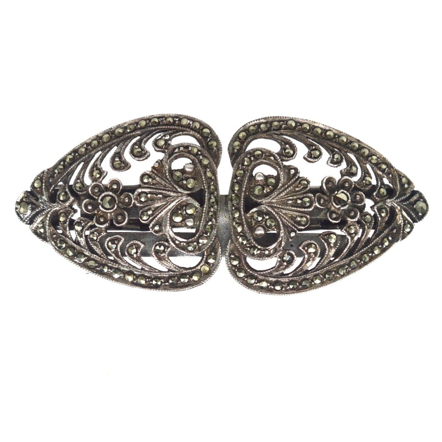 Art Deco silver and marcasite double clip brooch from 1927, featuring intricate floral designs and a vintage appeal.