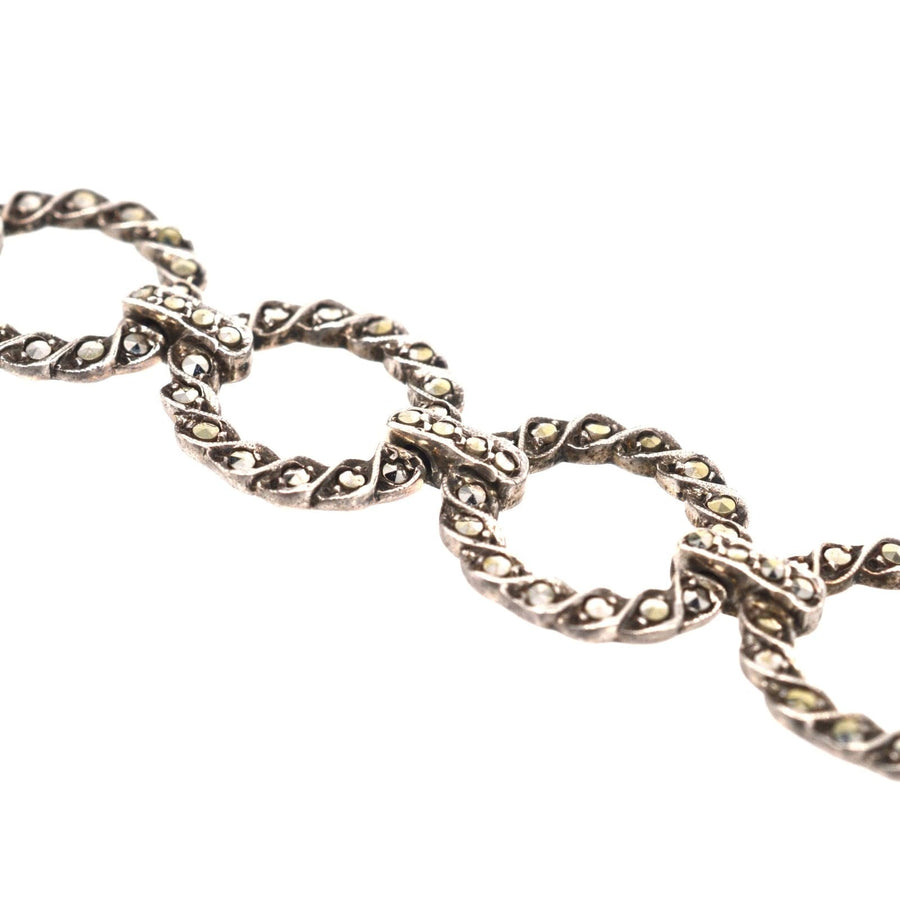 Art Deco silver bracelet featuring marcasite-set round circle design, showcasing intricate circlets and bars.
