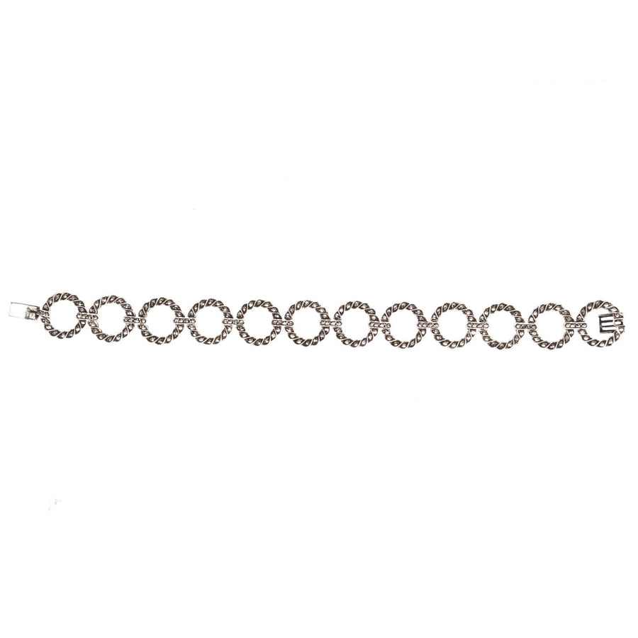 Art Deco silver and marcasite round circle design bracelet featuring interconnected circlets and elegant detailing.