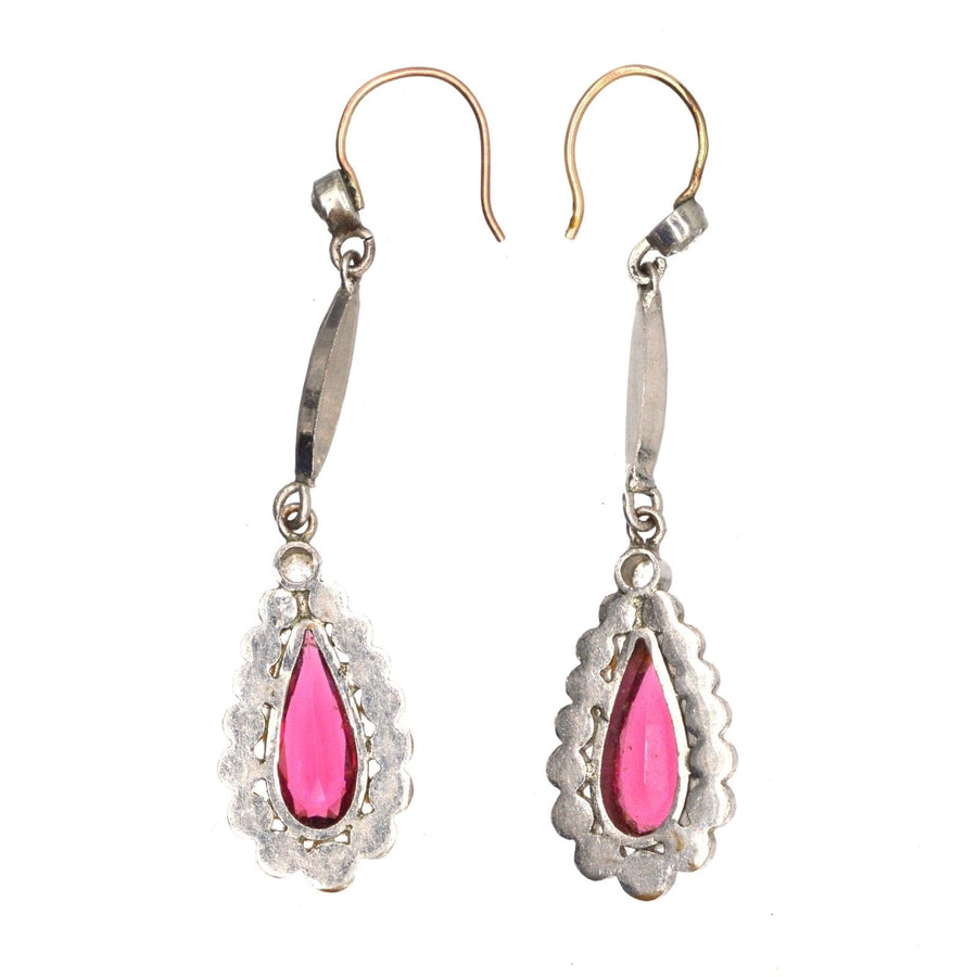 Art Deco silver-tone drop earrings featuring pear-shaped red 'ruby' paste stones from the 1920s.