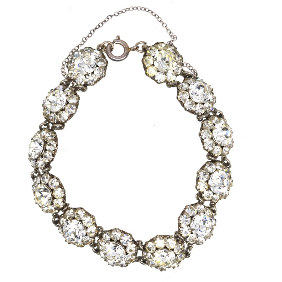 Art Deco silver bracelet featuring twelve clusters of elegant 'diamond' paste stones, reflecting a luxurious design.