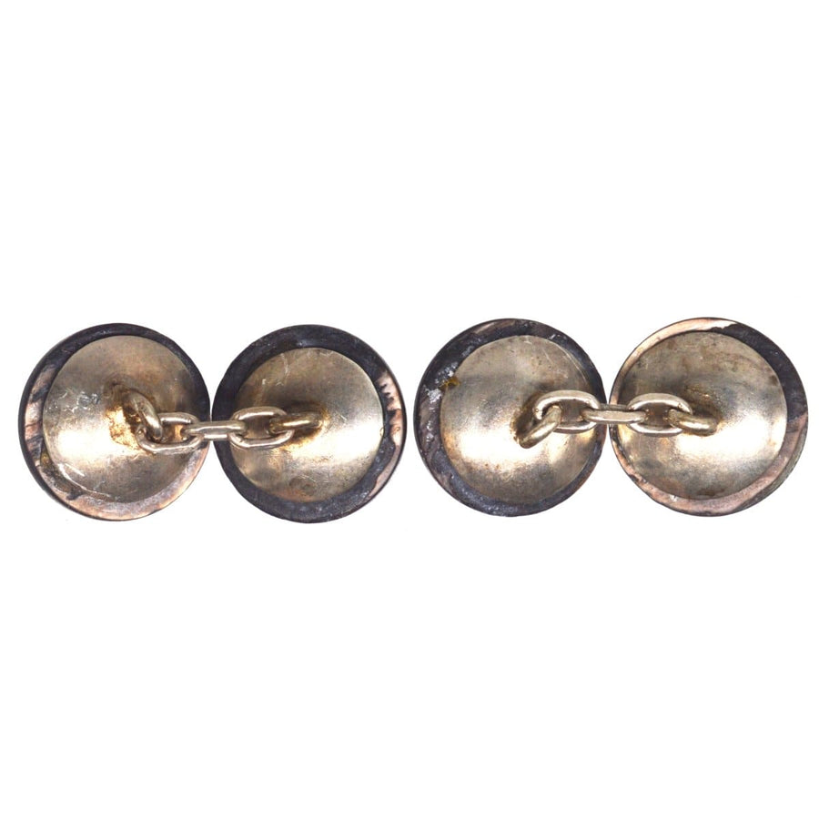Art Deco Tahitian black mother of pearl button cufflinks with gold accents connected by a chain.