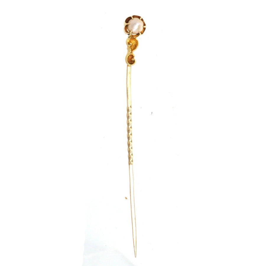 Art Nouveau 15ct gold tie pin featuring a lustrous pearl and baroque scroll, crafted in the 1890s.