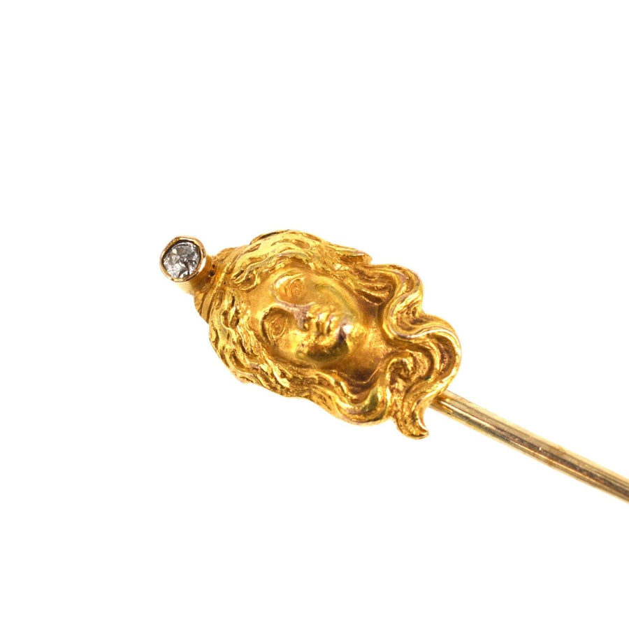Art Nouveau 15ct gold pin featuring a woman's portrait with diamond, showcasing the charm of early 20th century design.