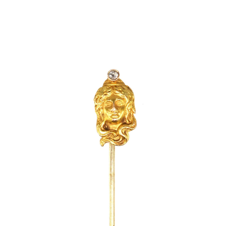 Art Nouveau 15ct gold pin featuring a lady's portrait with a diamond, showcasing the elegance of the era.