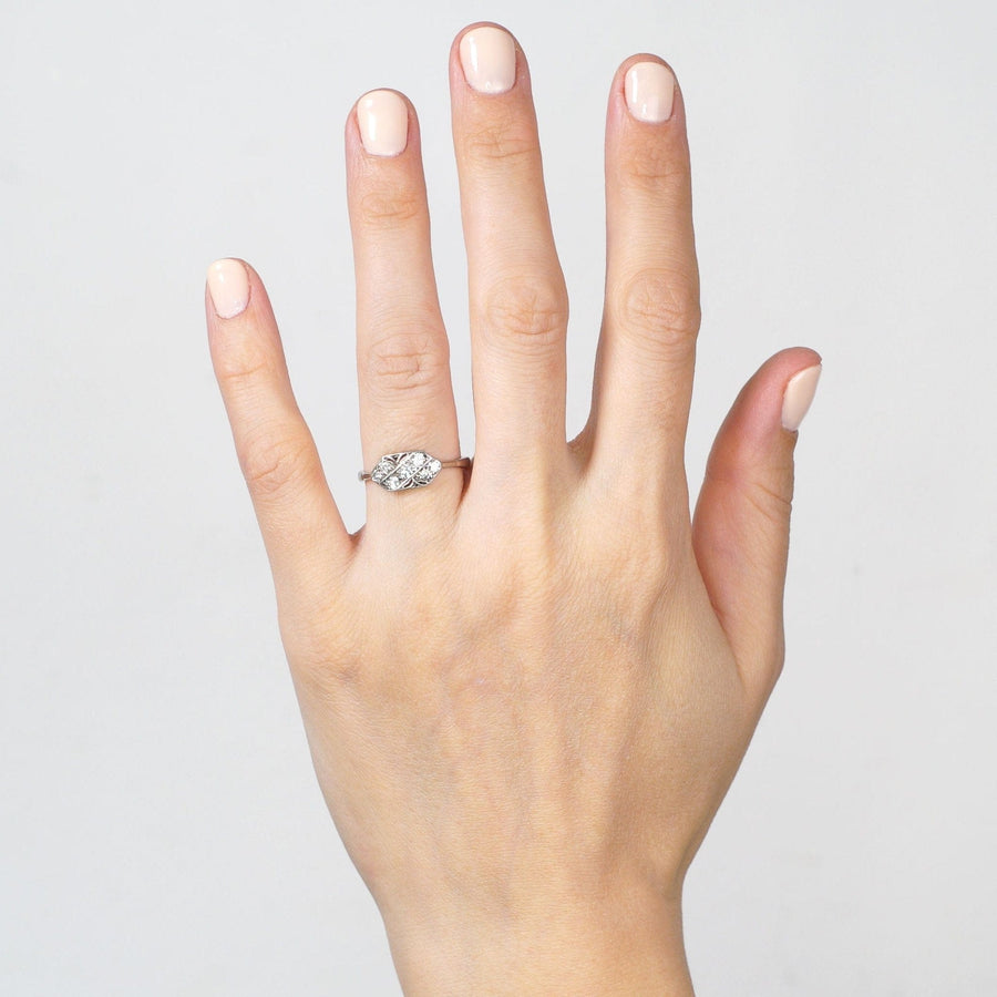 Elegant Art Nouveau 18ct white gold and platinum diamond ring showcased on a hand, featuring a naturalistic design.