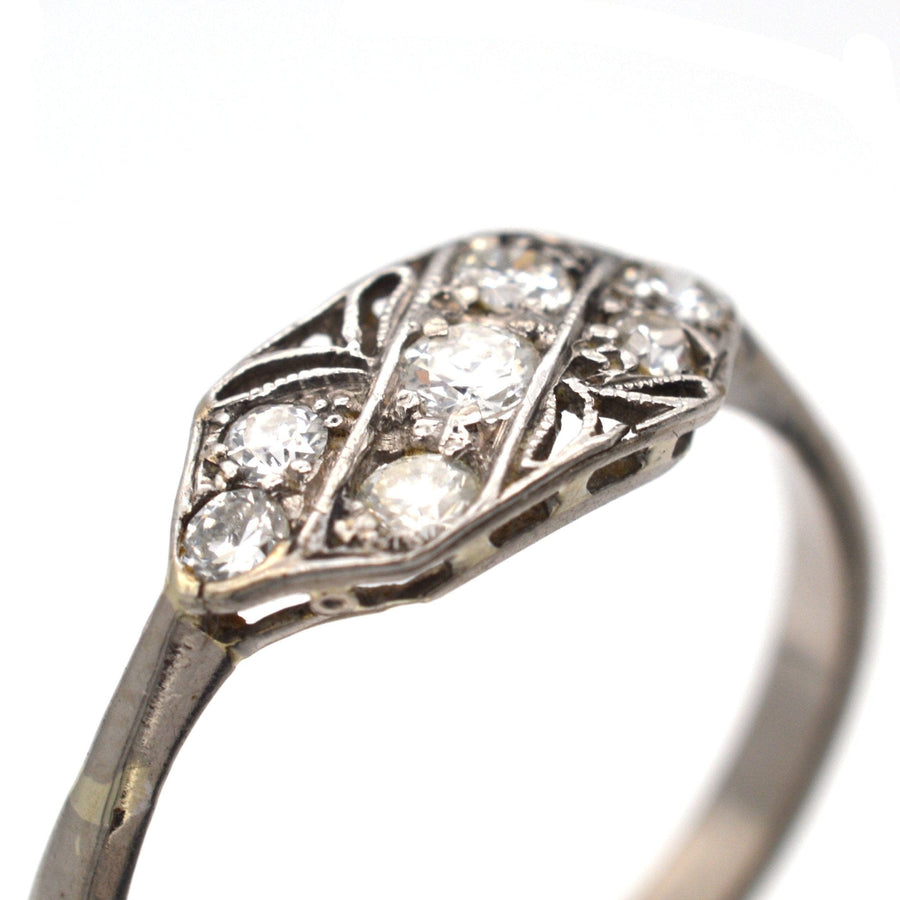 Art Nouveau 18ct white gold and platinum diamond ring with intricate lace design, featuring 0.25 carats of bright diamonds.