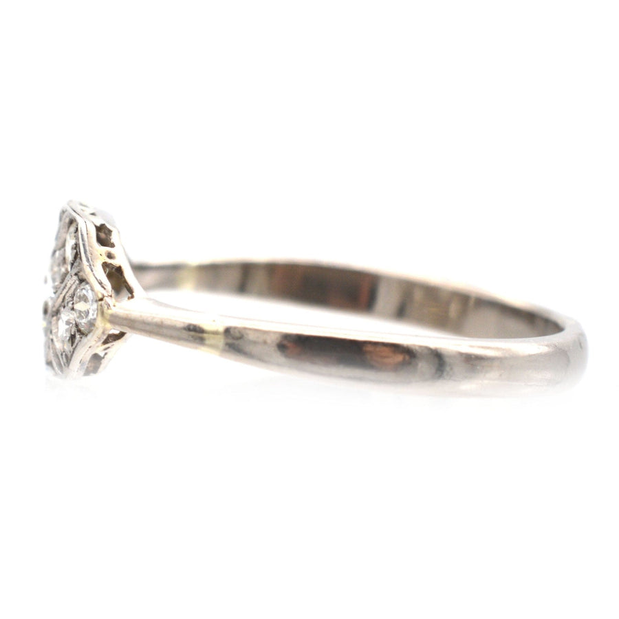 Art Nouveau 18ct white gold and platinum diamond ring with naturalistic design, featuring 0.25 carats of diamonds.
