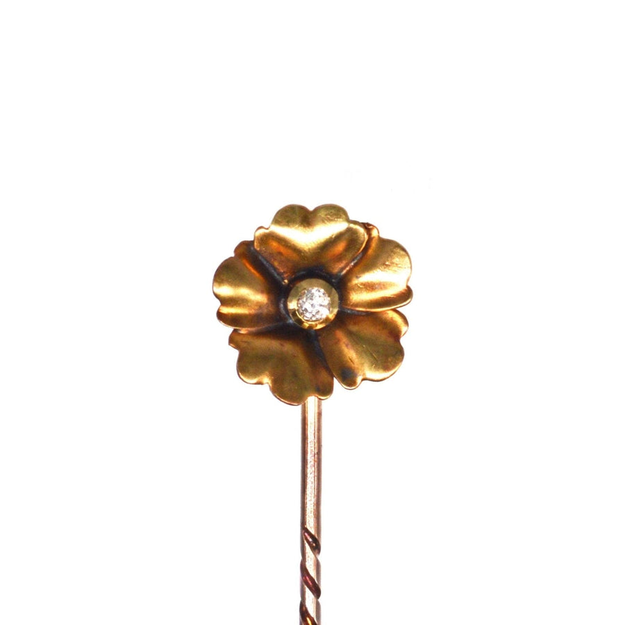 Art Nouveau 9ct gold flower tie pin with diamond center, featuring elegant curves and vintage charm.