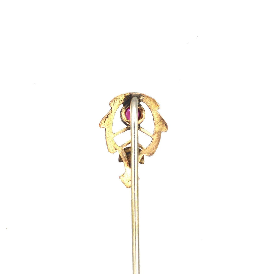 Art Nouveau 9ct two colour gold tie pin featuring a ruby in a delicate millegrain setting.