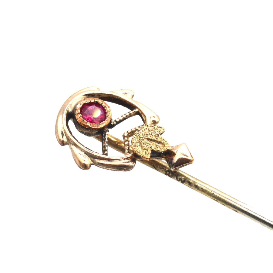 Art Nouveau 9ct two colour gold tie pin featuring a ruby and stylised gold leaves, perfect for silk ties.