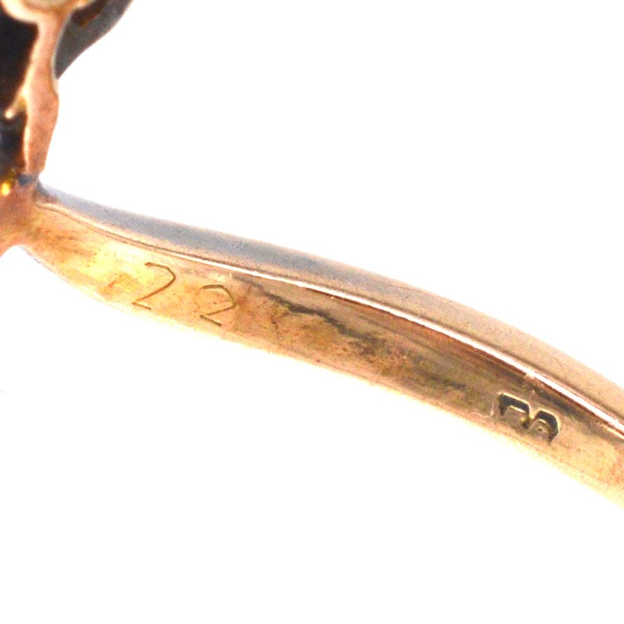 Detail of the inner band of an Austro-Hungarian Art Nouveau diamond flower ring, showing 22k gold markings.