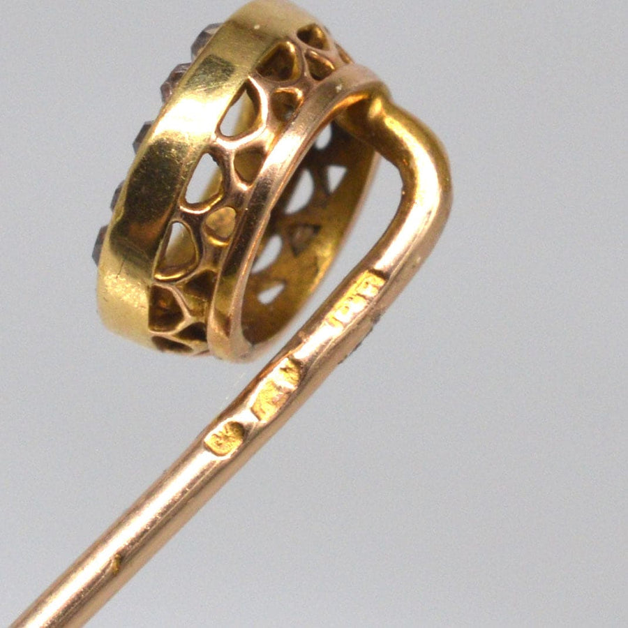 Close-up of an Austro-Hungarian 14ct gold and diamond finishing post tie pin, showcasing intricate circle design.